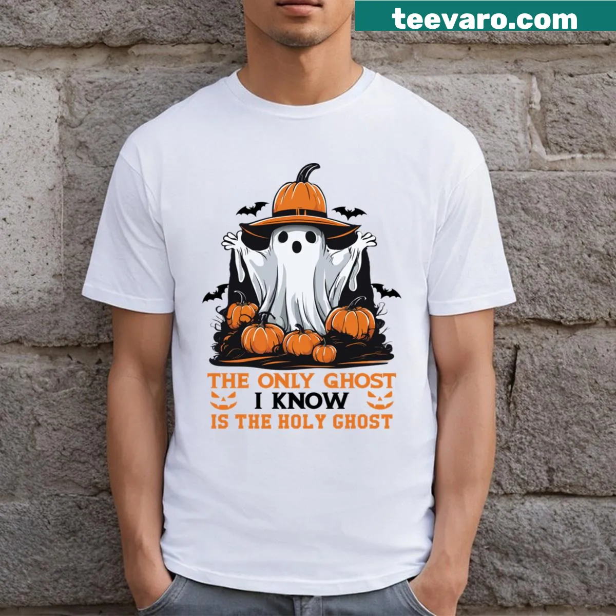 Halloween T-shirt with 'The Only Ghost I Know Is The Holy Ghost' text and pumpkin graphic — on a men's t-shirt