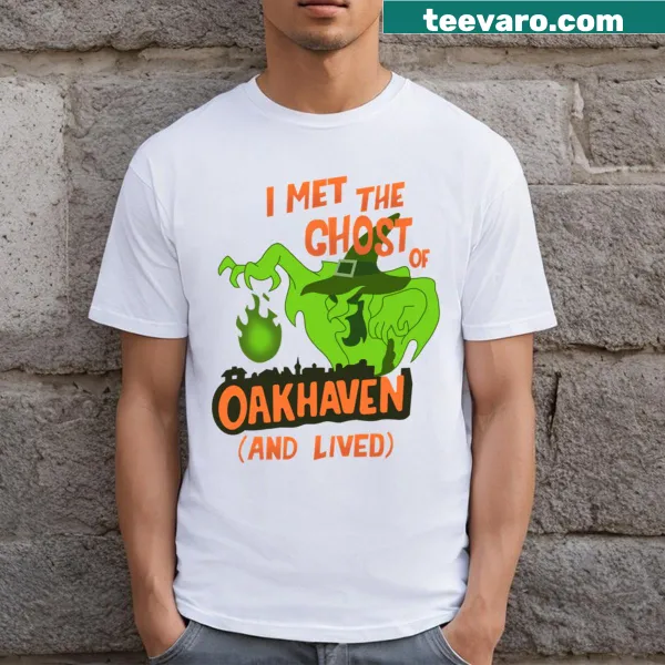 Whimsical witch and ghost design on T-shirt for Halloween.