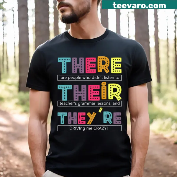 Funny English grammar teacher t-shirt highlighting the words there, their, and they're
