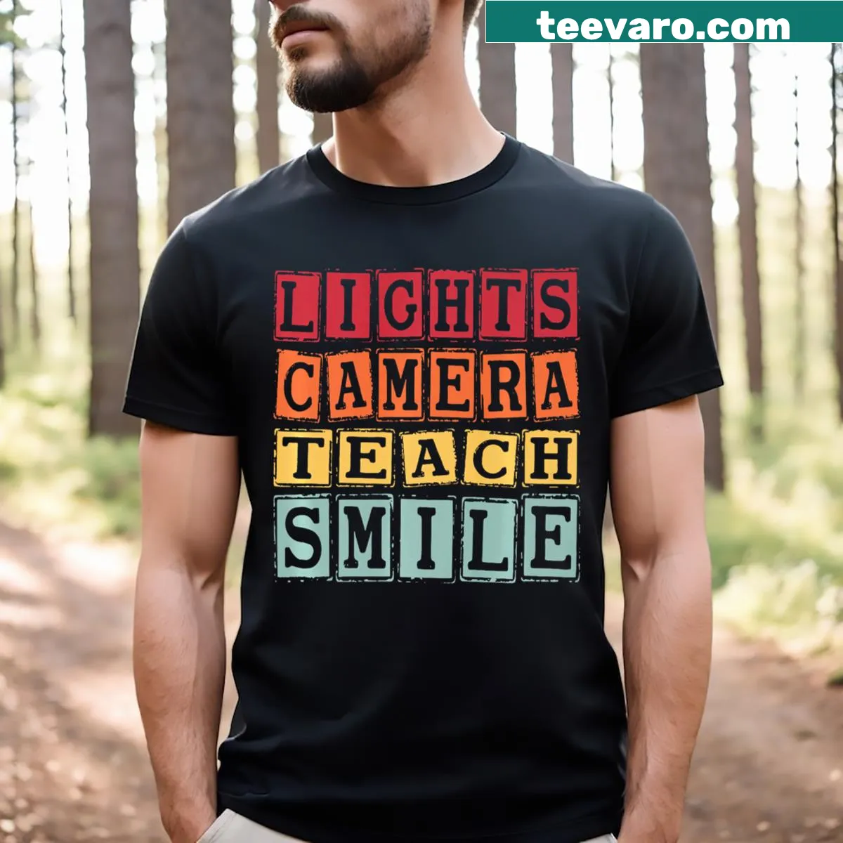 Funny teacher t-shirt with the phrase 'Lights Camera Teach Smile' — on a men's t-shirt