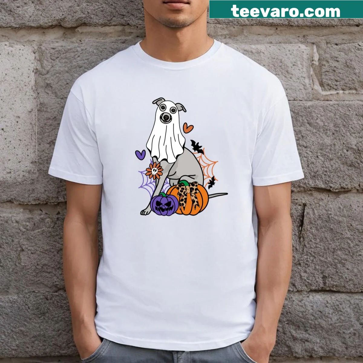 Halloween-themed whippet design with ghosts and pumpkins on a t-shirt — on a men's t-shirt