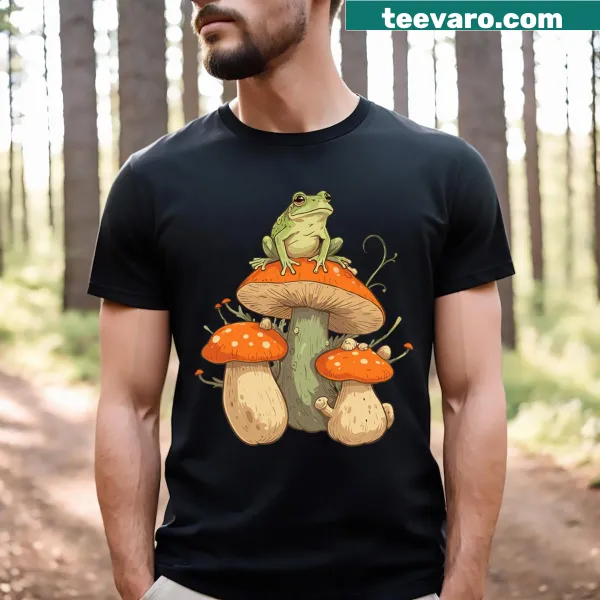 Illustrated cottagecore design with frogs and mushrooms on a T-shirt