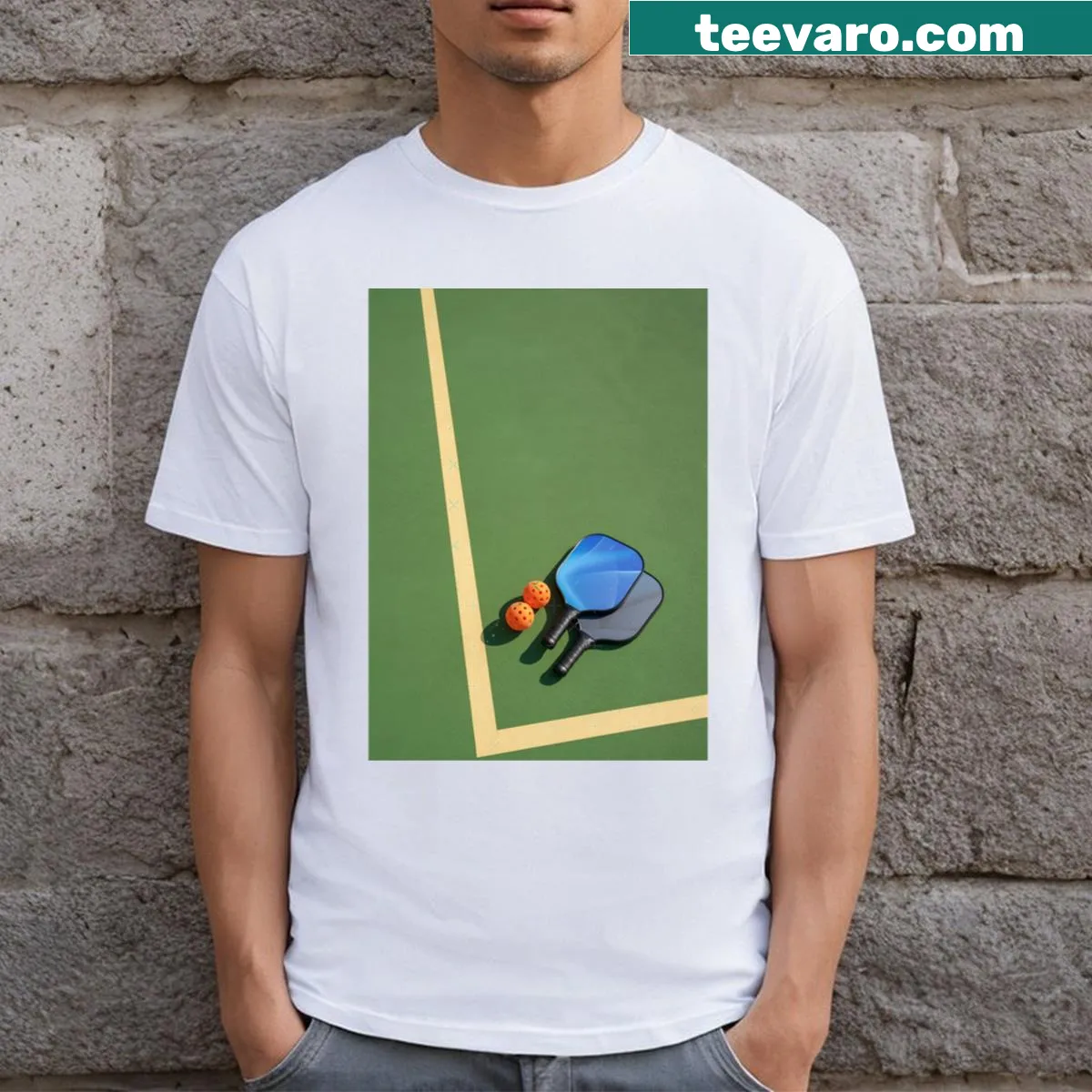 Realistic graphic of a pickleball paddle and ball on a T-shirt — on a men's t-shirt