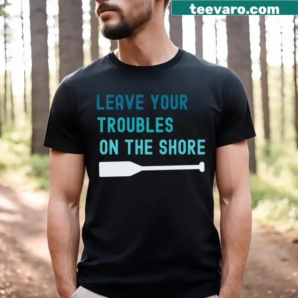 T-shirt with the phrase 'Leave Your Troubles On The Shore' and paddle design