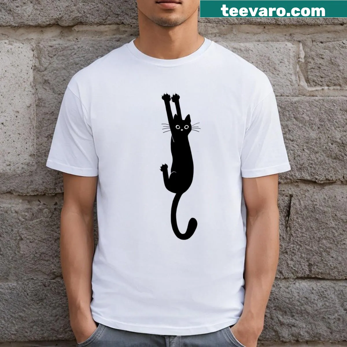 Essential T-shirt featuring an illustration of a black cat holding on — on a men's t-shirt