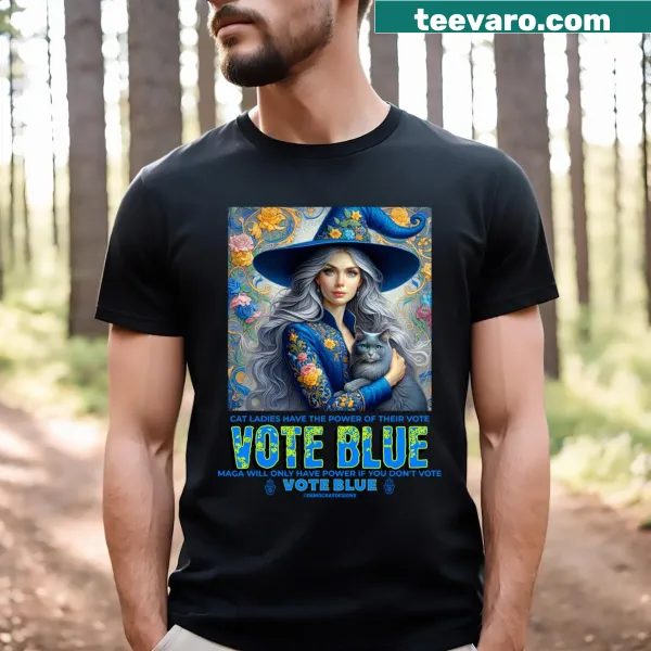 T-shirt featuring a blue witch and floral cat design, merging Halloween magic and civic engagement