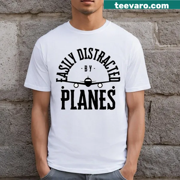 Cute graphic of a baby orangutan playing guitar on a T-shirt
