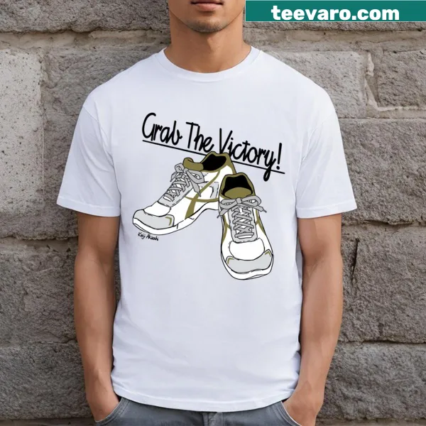 T-shirt featuring volleyball shoes graphic celebrating the sport.