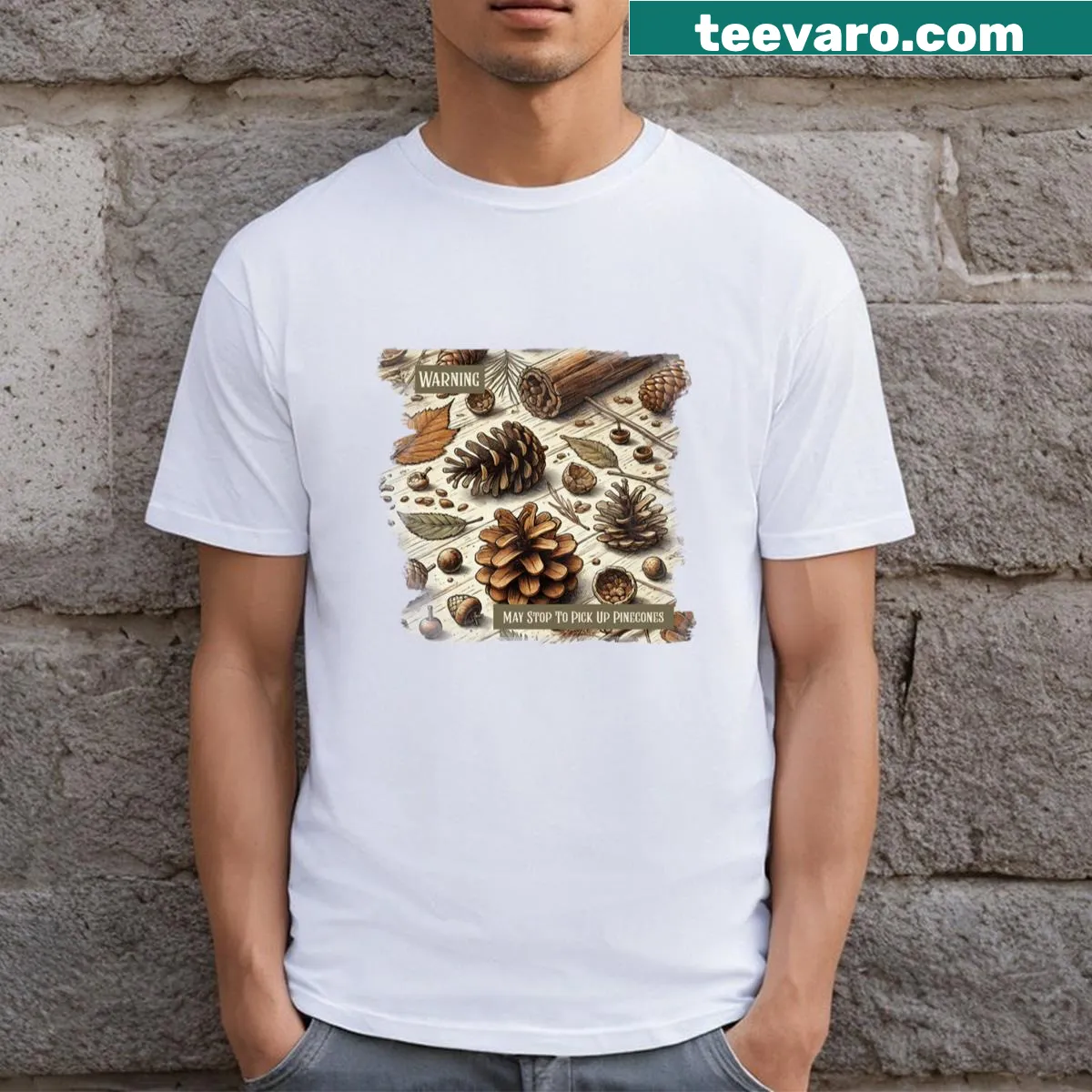 T-shirt with playful warning graphic about picking up pinecones — on a men's t-shirt