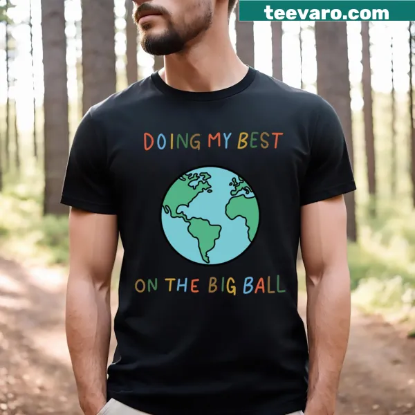 T-shirt with a playful slogan about doing your best on a big ball.