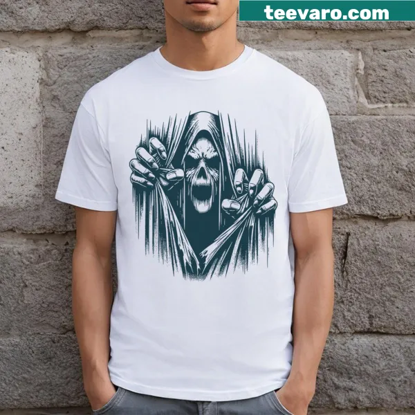 Scary ghoul graphic ripping through body on Halloween T-shirt.
