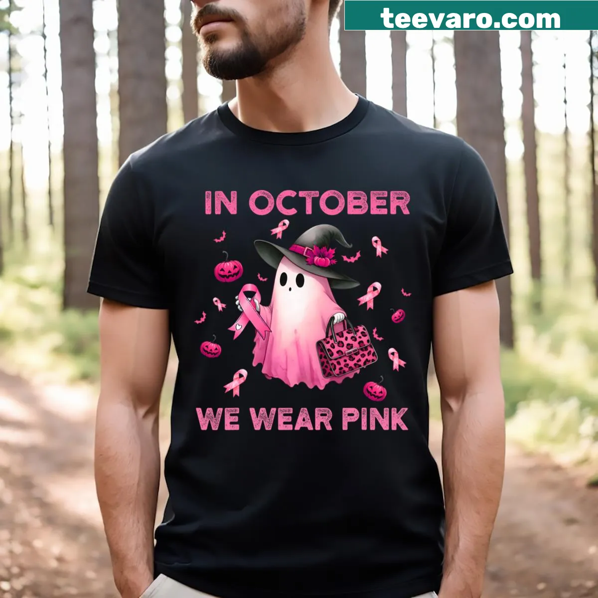 Halloween T-shirt featuring a pink ghost design for breast cancer awareness. — on a men's t-shirt