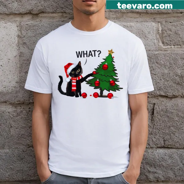 Cartoon black cat knocking over Christmas tree on t-shirt