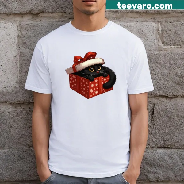 Black cat surrounded by holiday elements on a Christmas t-shirt