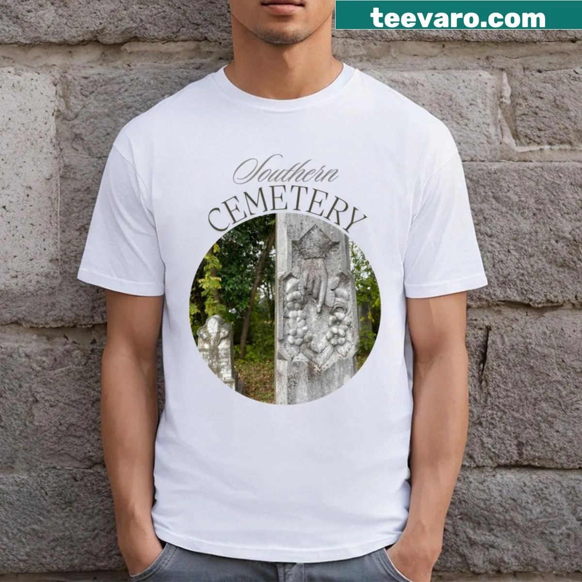 T-shirt with graphic of a skeletal hand in a cemetery — on a men's t-shirt