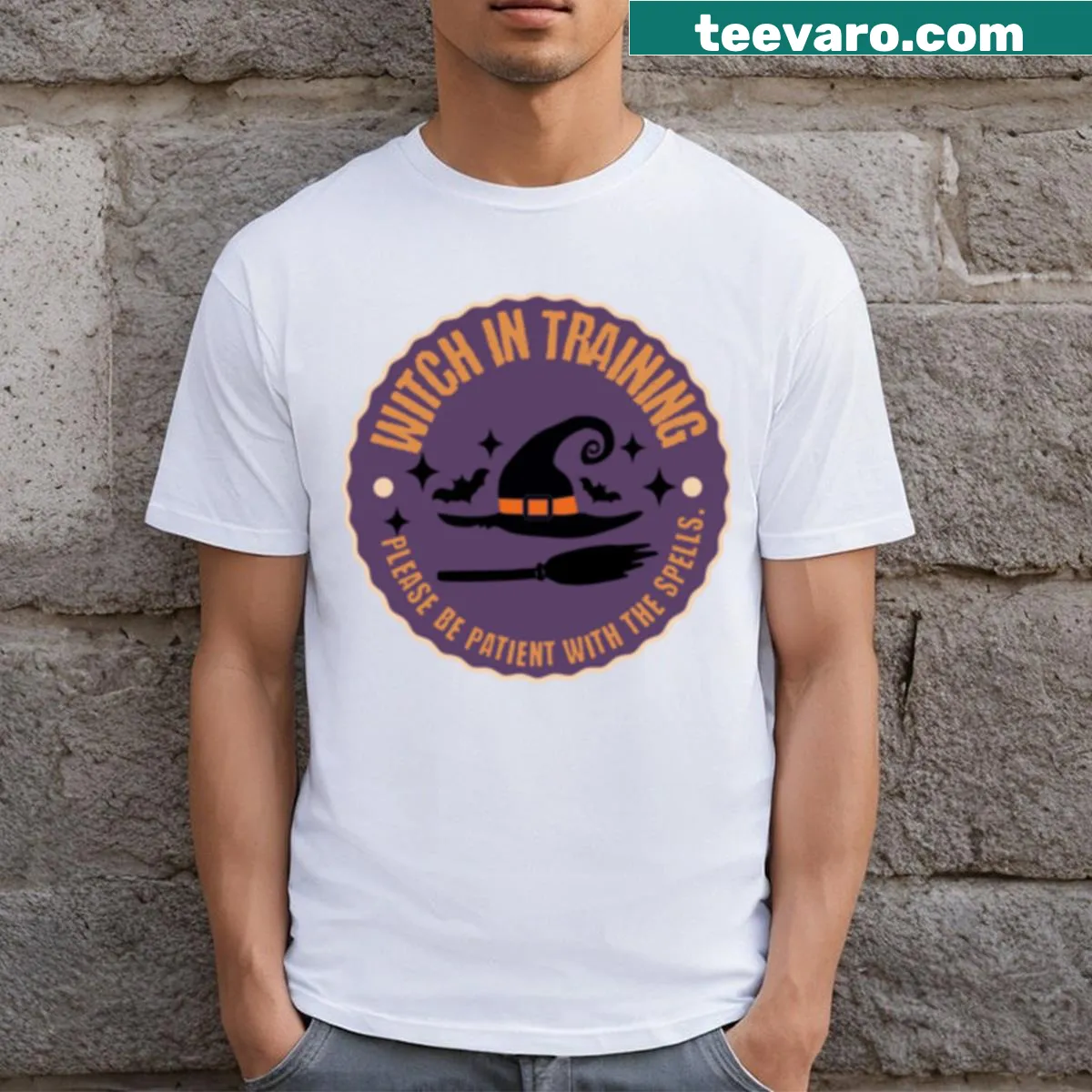 Cute T-shirt with 'Witch In Training' badge design for Halloween — on a men's t-shirt