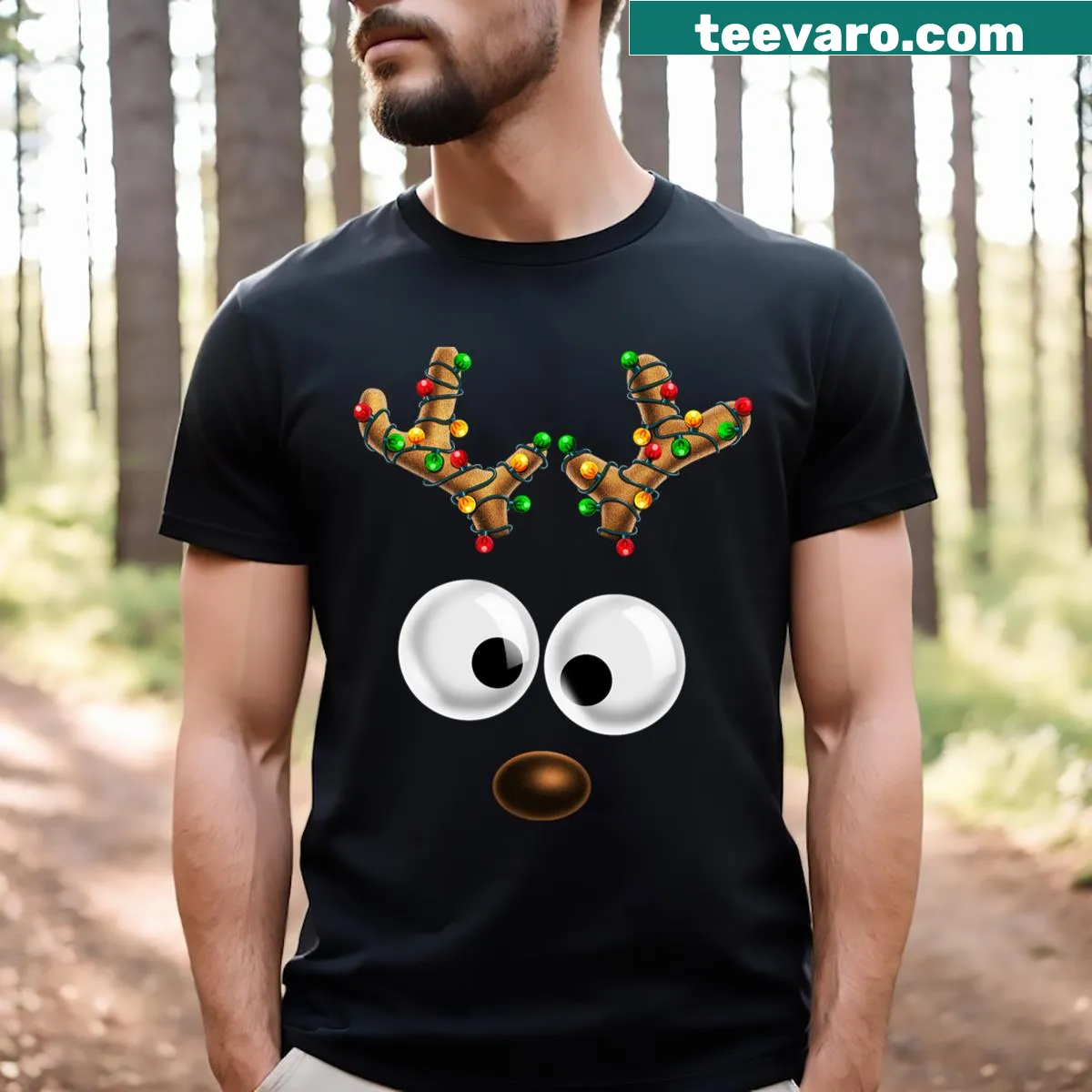 Kids Christmas T-shirt featuring a cute reindeer face illustration — on a men's t-shirt