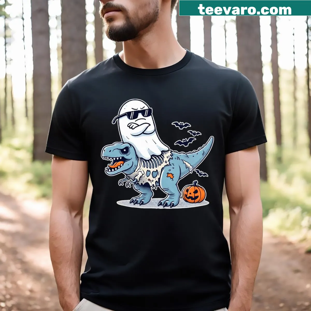 Funny Halloween T-shirt featuring a ghost riding a zombie T-Rex. — on a men's t-shirt