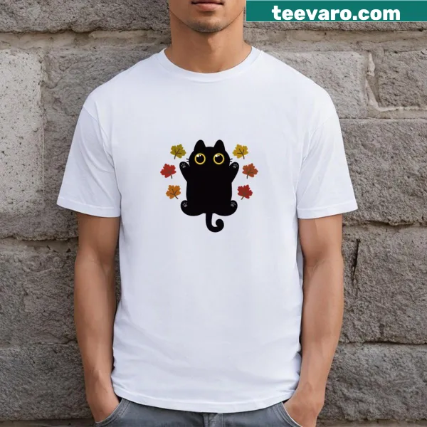 A cute cat surrounded by autumn leaves on a T-shirt