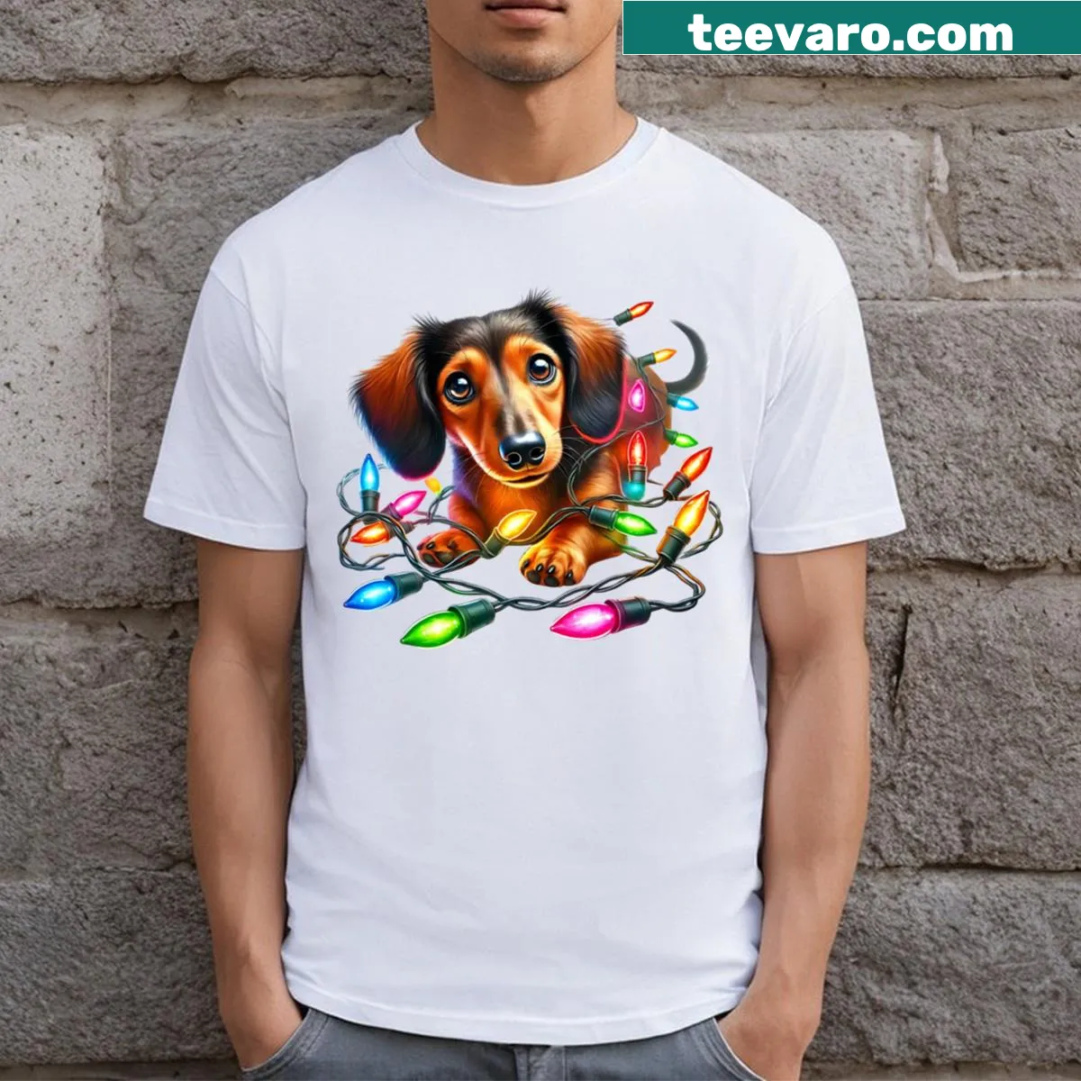 Dachshund playing in Christmas lights graphic t-shirt — on a men's t-shirt