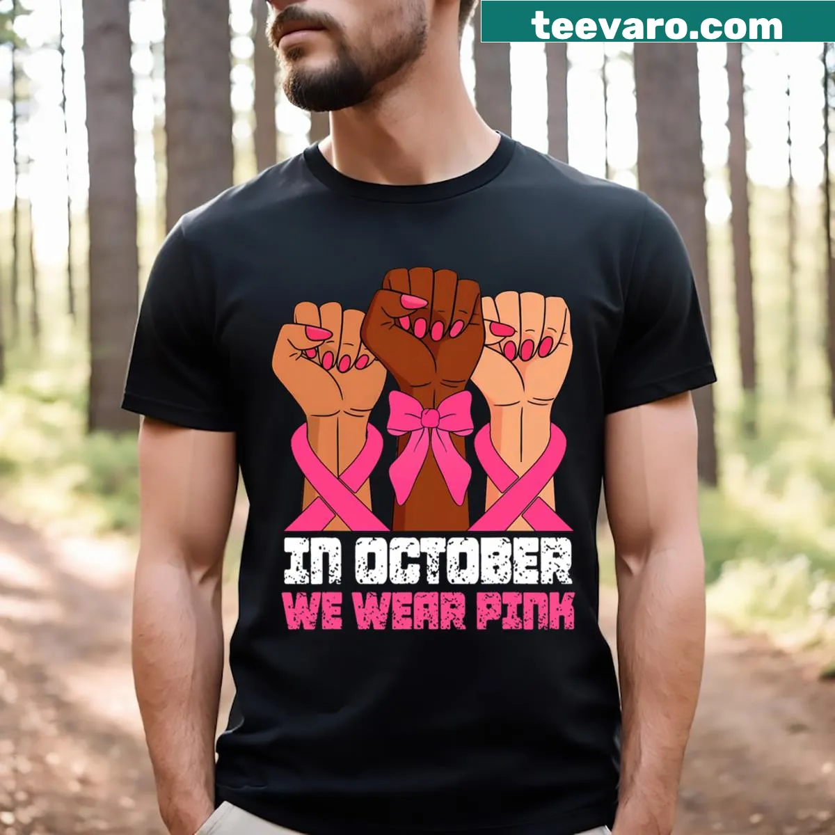 Breast cancer awareness t-shirt with pink raised fists design — on a men's t-shirt