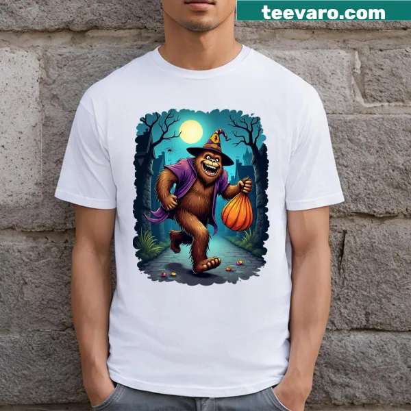 Illustrative T-shirt featuring Sasquatch trick-or-treating for Halloween.