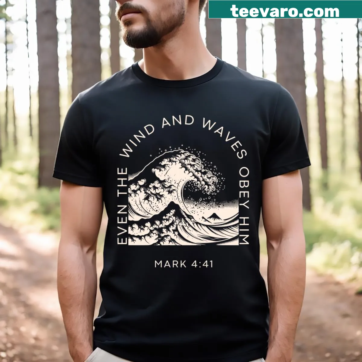 Christian t-shirt with the phrase 'Even The Wind And The Waves Obey Him' in bold text — on a men's t-shirt