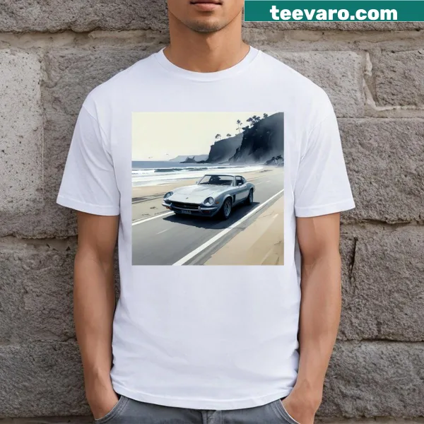 T-shirt showing a car driving along the sea with scenic illustration