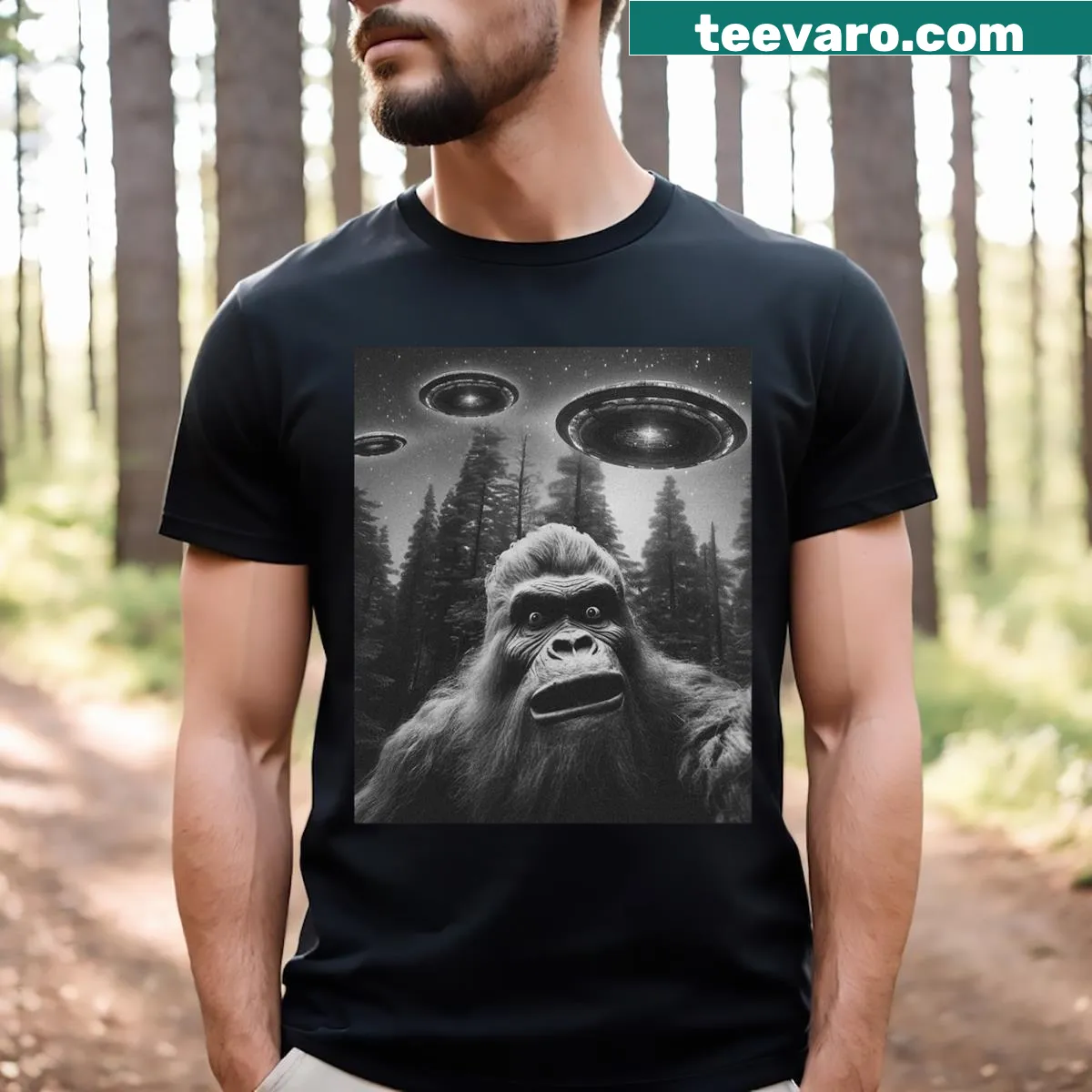 Funny graphic T-shirt featuring Bigfoot, Sasquatch, and UFO illustrations — on a men's t-shirt