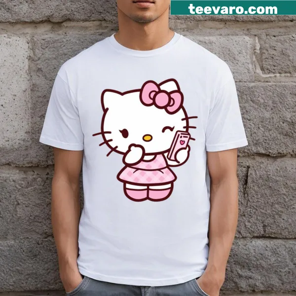 Cute pink t-shirt with a cartoon cat face and playful text