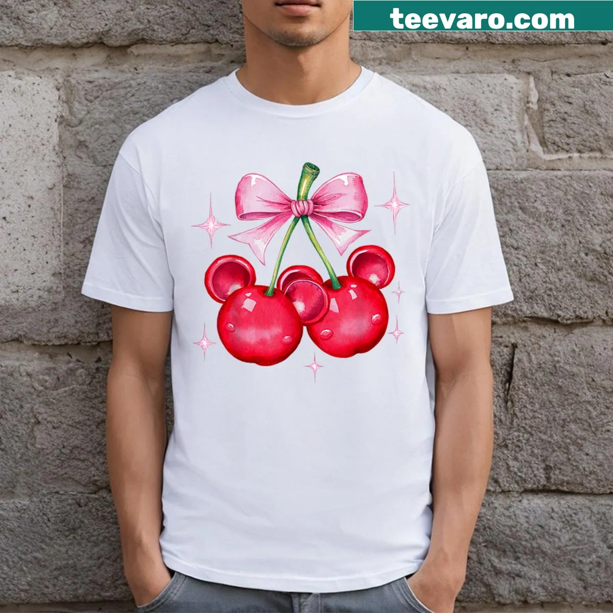 Whimsical T-shirt featuring mouse ears with a cherry bow design. — on a men's t-shirt