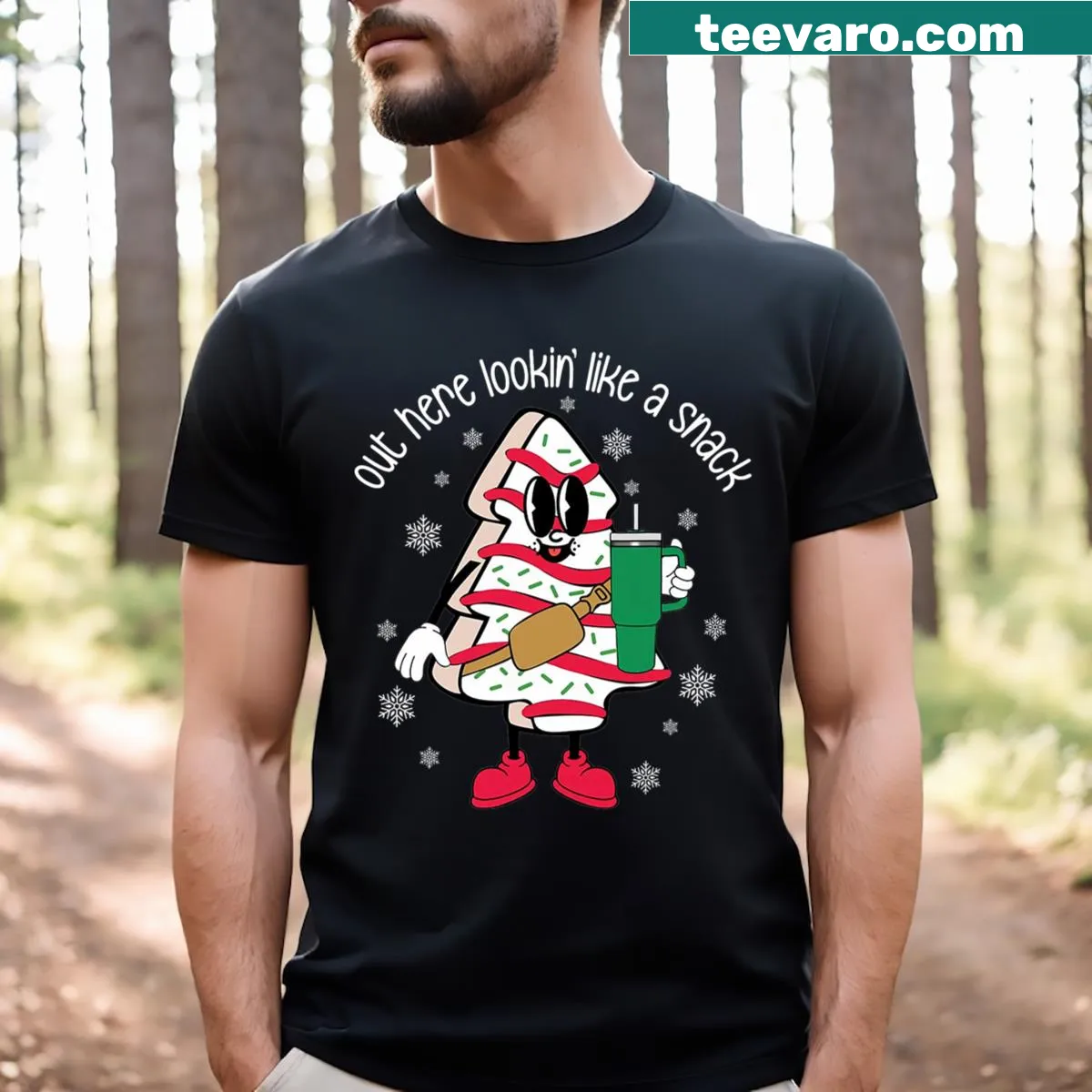 Funny Christmas T-shirt with a cake and tree illustration and playful text — on a men's t-shirt