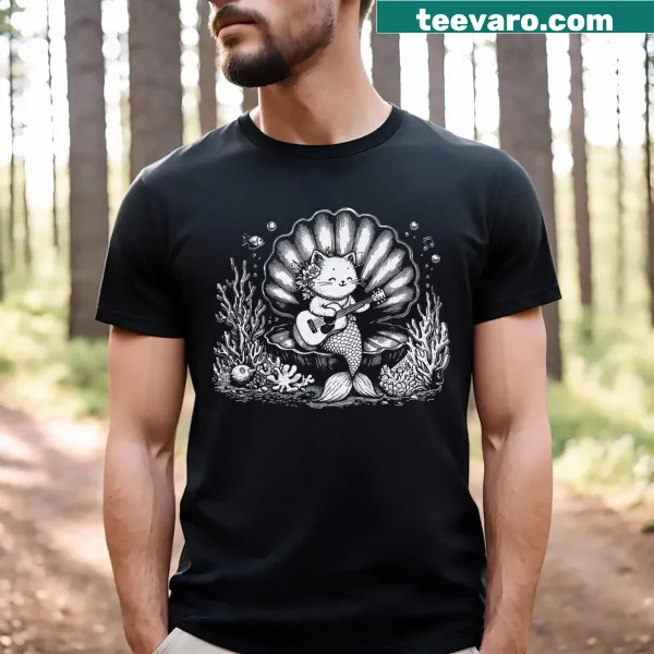 Cartoon t-shirt featuring a cat mermaid playing guitar