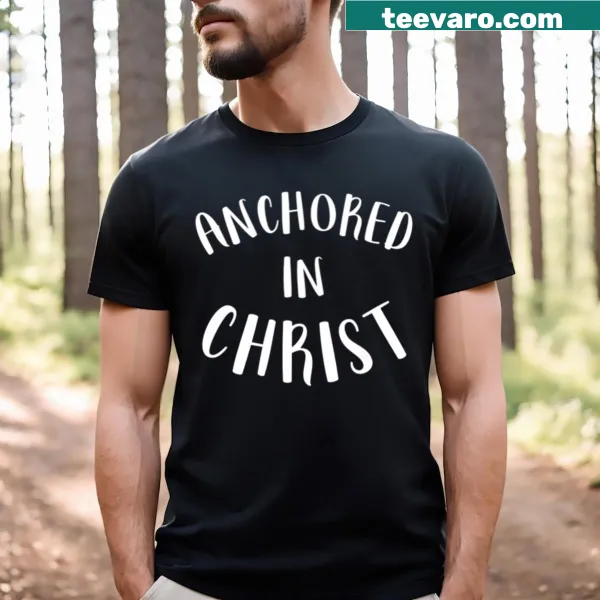 Inspirational Christian T-shirt with 'Anchored In Christ' text.