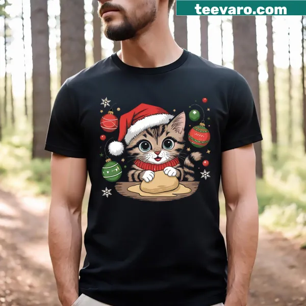 Cute T-shirt featuring a cat Santa baking in the kitchen