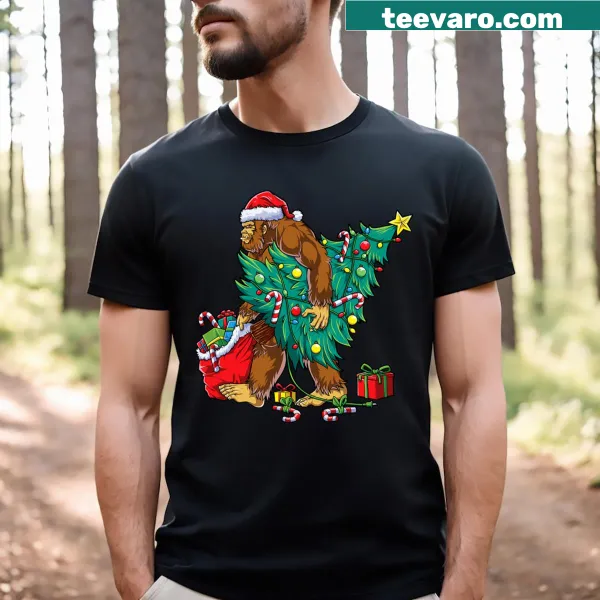 Bigfoot Christmas T-shirt featuring Sasquatch with tree lights