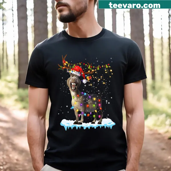 Whimsical T-shirt with a cartoon donkey wrapped in Christmas tree lights.
