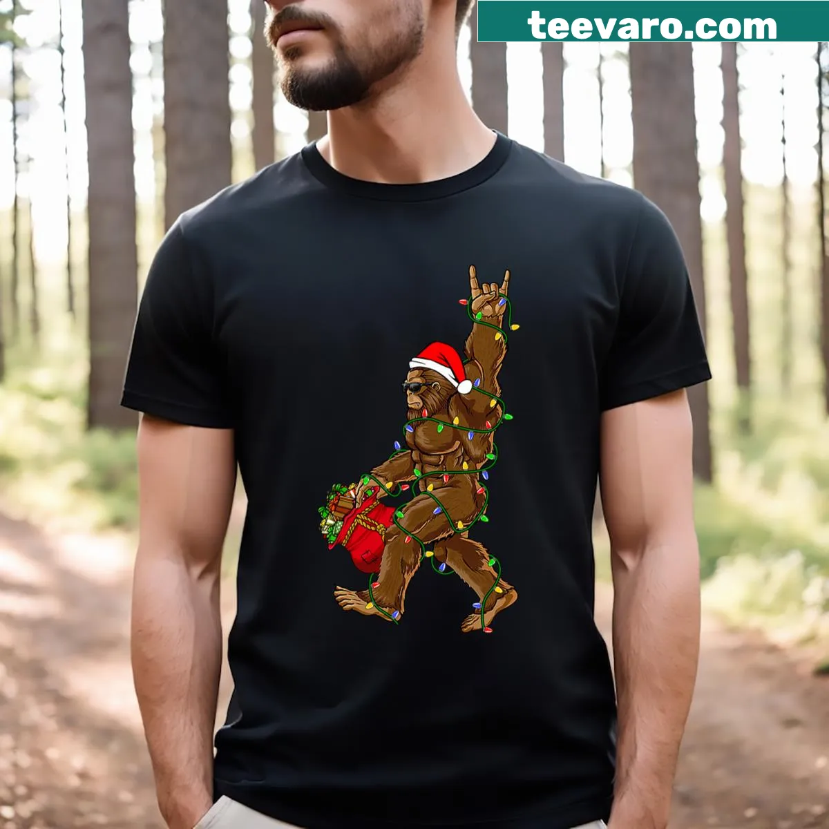 Funny Christmas-themed t-shirt featuring Bigfoot with lights — on a men's t-shirt