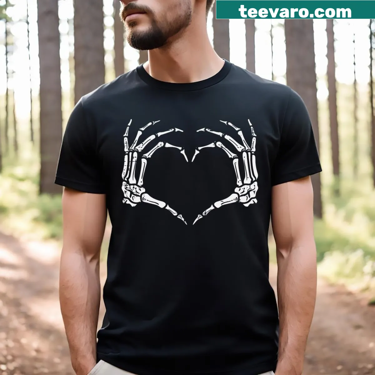 Skeleton hands forming a heart graphic on a Halloween T-shirt — on a men's t-shirt