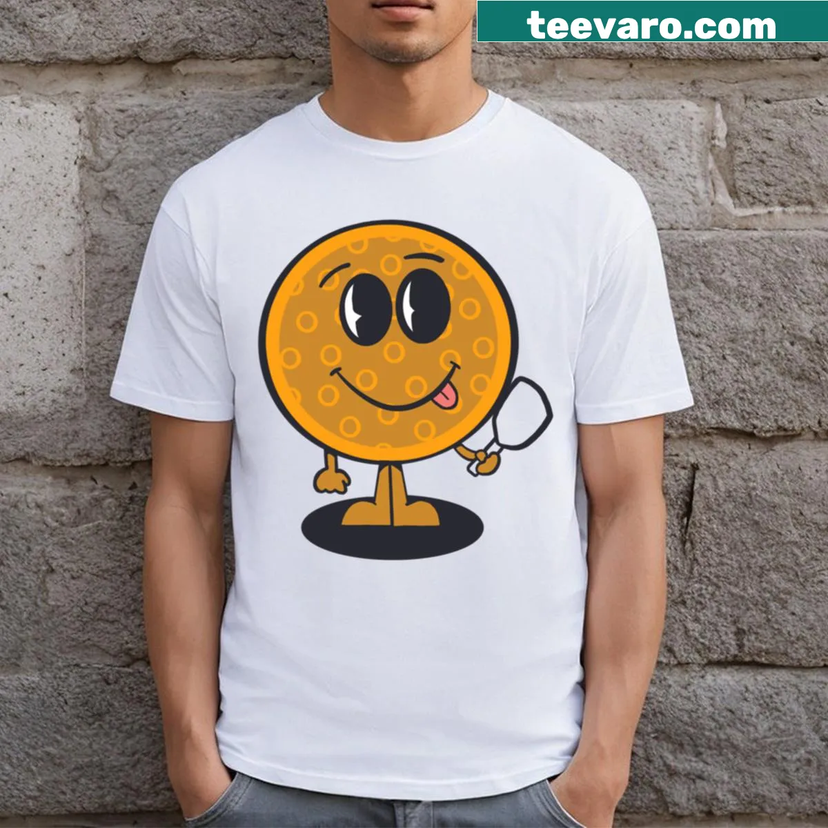 Cartoon of a pickleball player on a yellow t-shirt — on a men's t-shirt