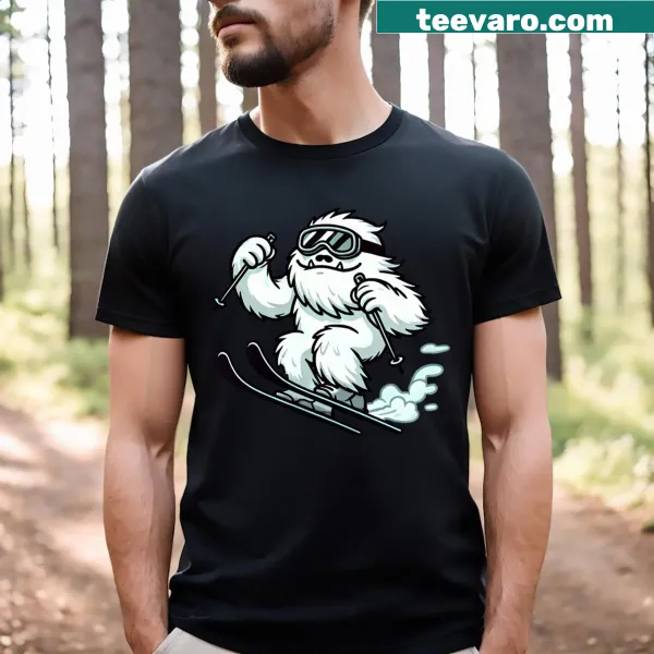 Cartoon yeti skiing down a mountain graphic on t-shirt