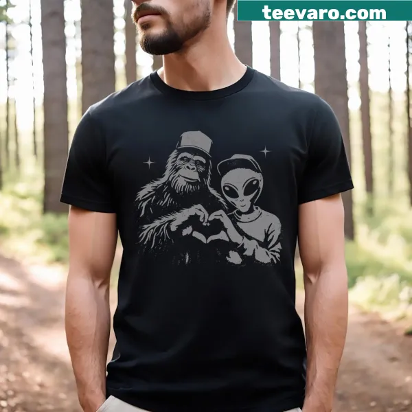 Graphic of Bigfoot and alien hand sign on T-shirt