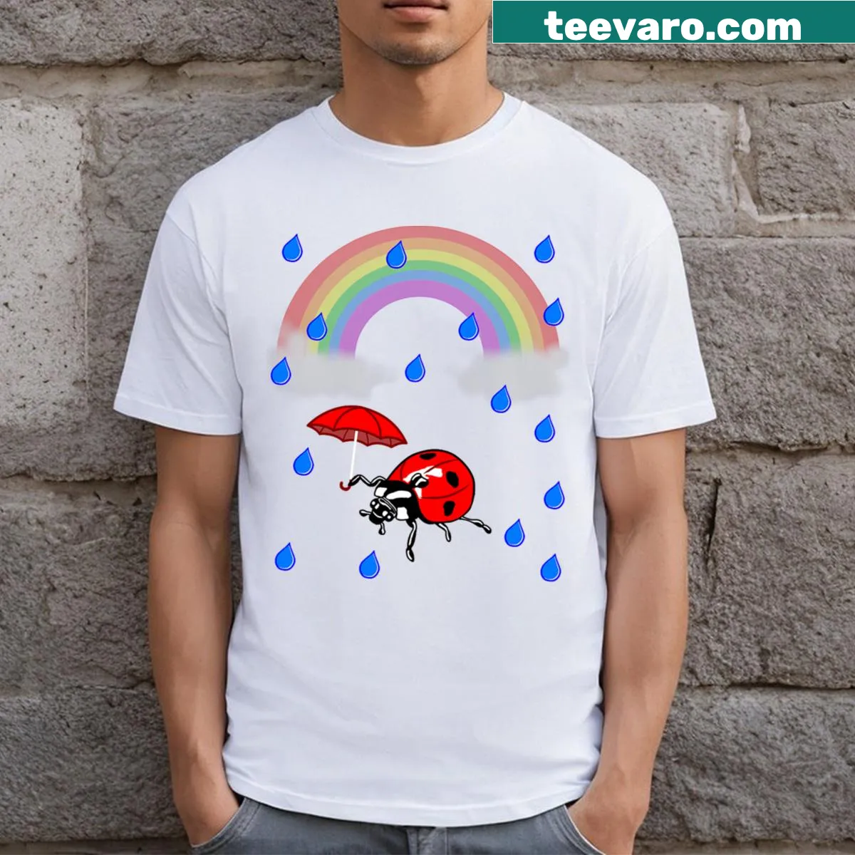 Playful T-shirt design with ladybug, umbrella, and rainbow — on a men's t-shirt