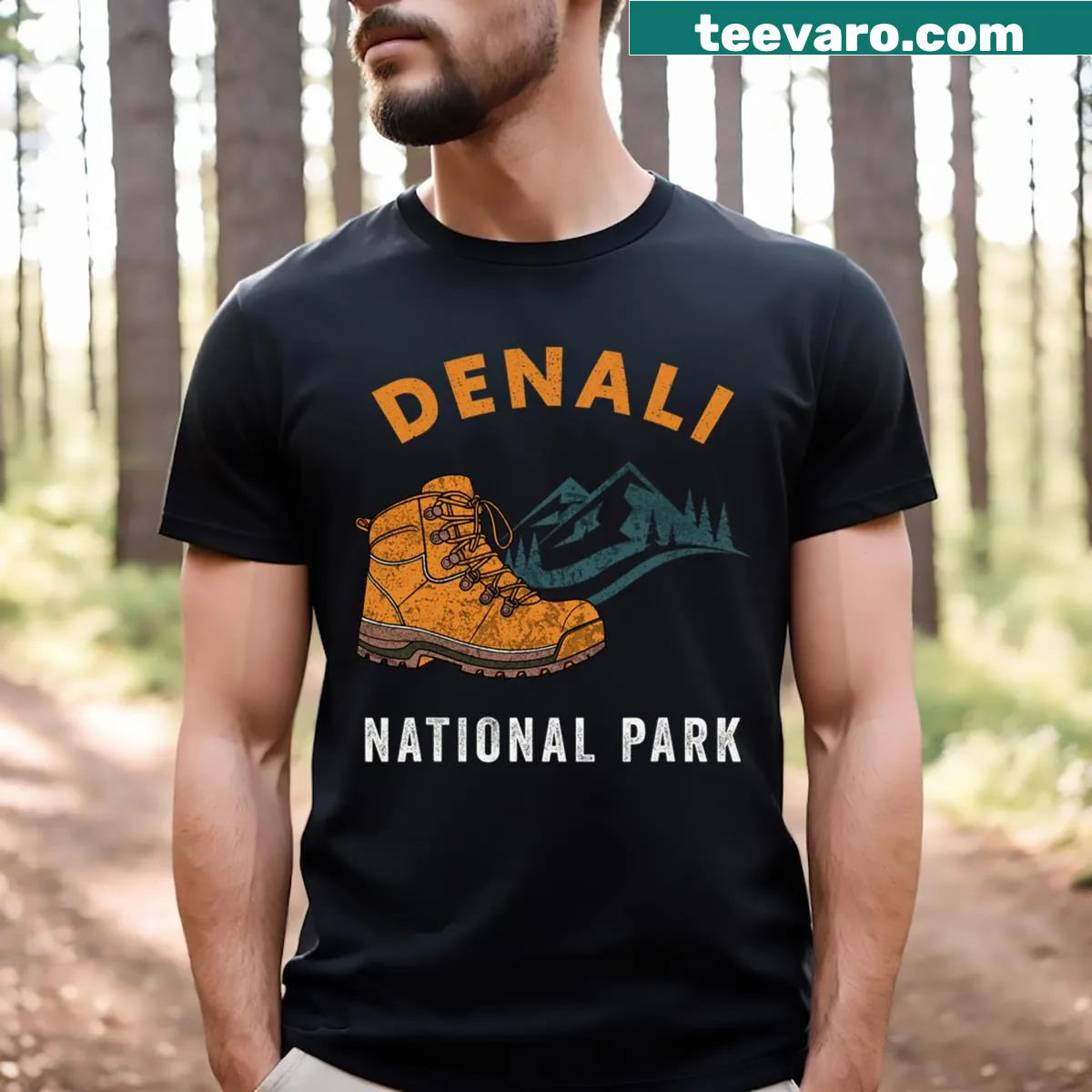 Graphic T-shirt featuring climbing boots and Mt. Denali design. — on a men's t-shirt
