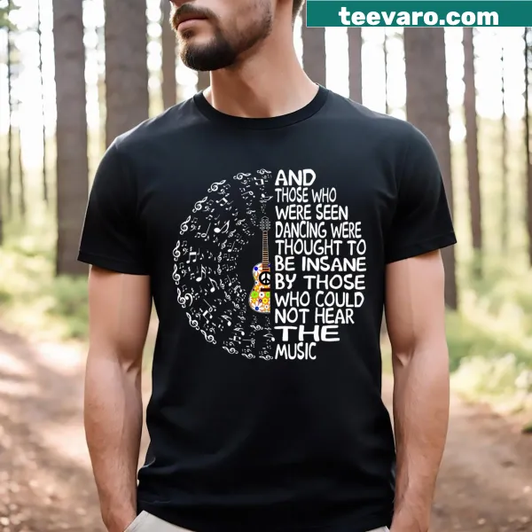 Illustrative shirt featuring a guitar and dancing figures with a peace theme