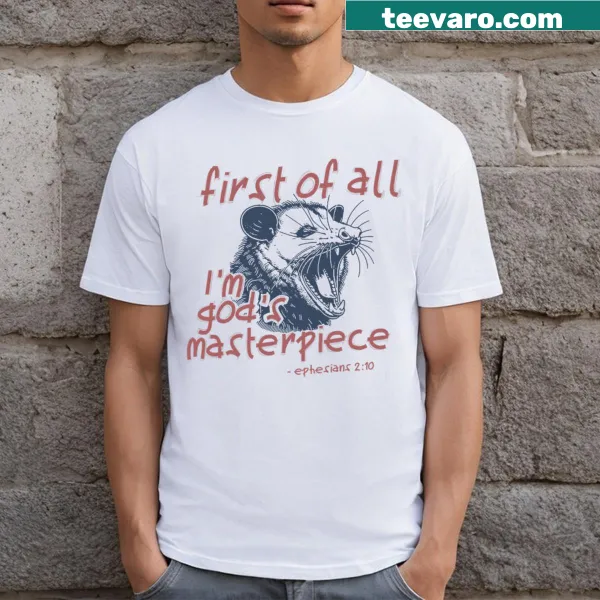 Raccoon graphic t-shirt with the text 'First Of All I'm God's Masterpiece'