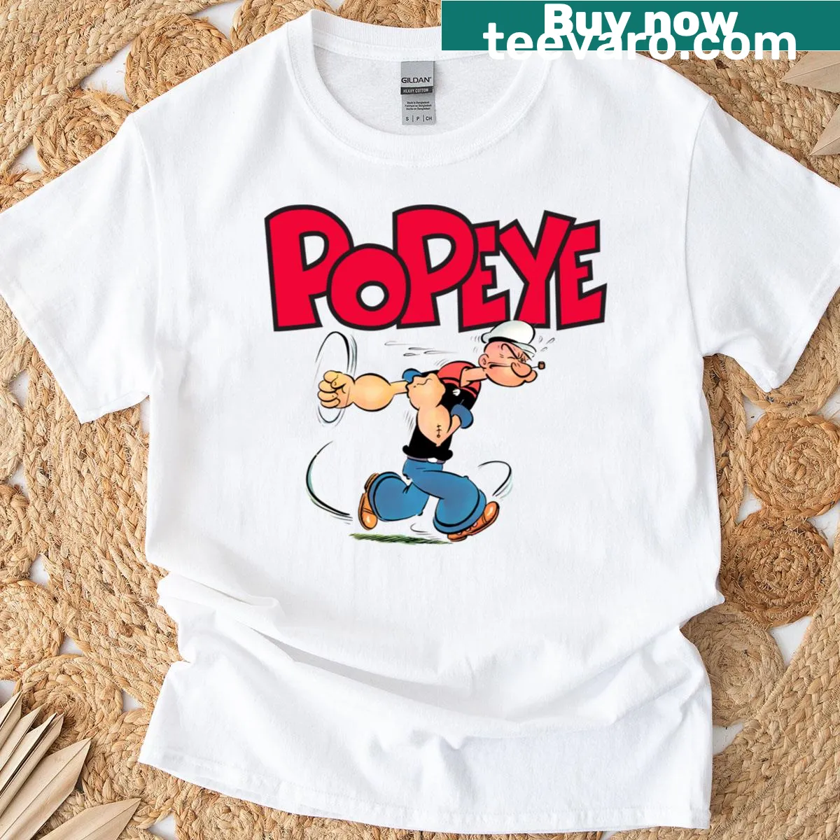 T-shirt featuring cartoon graphic of Popeye the sailor — on a men's t-shirt