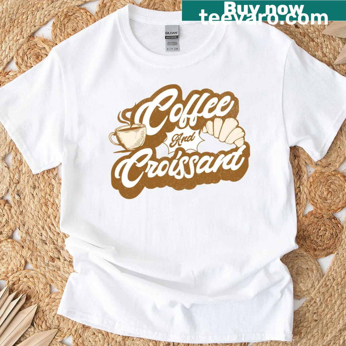 Retro-style t-shirt featuring coffee and croissant illustration — on a men's t-shirt