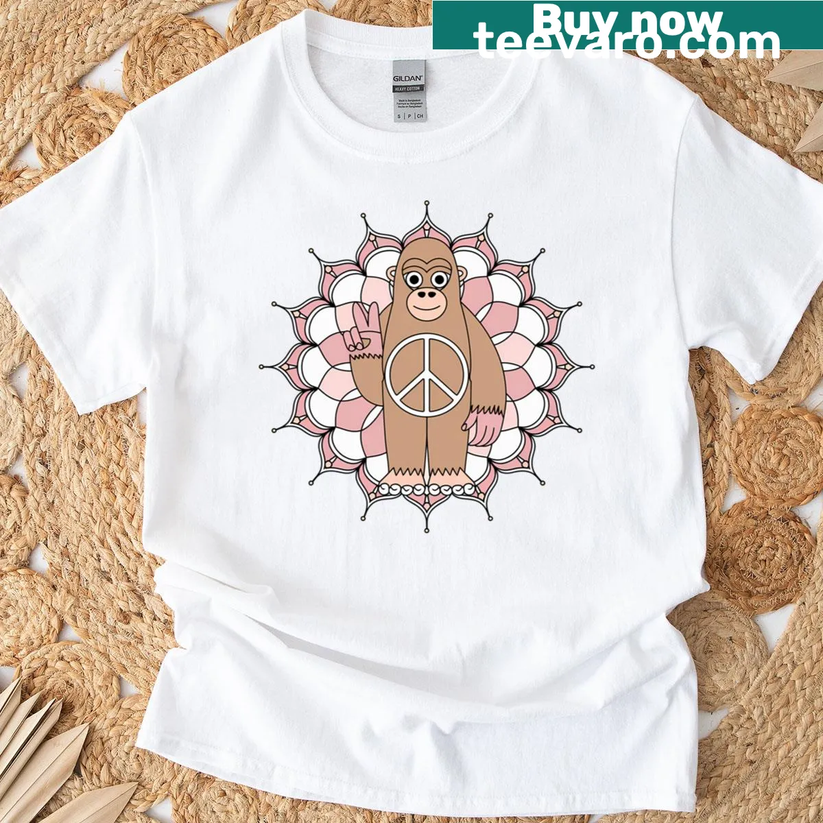 Illustrated peaceful Sasquatch with mandala graphic on t-shirt — on a men's t-shirt