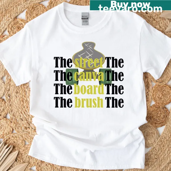 A T-shirt featuring the phrase about street art and creativity in a playful typography design.